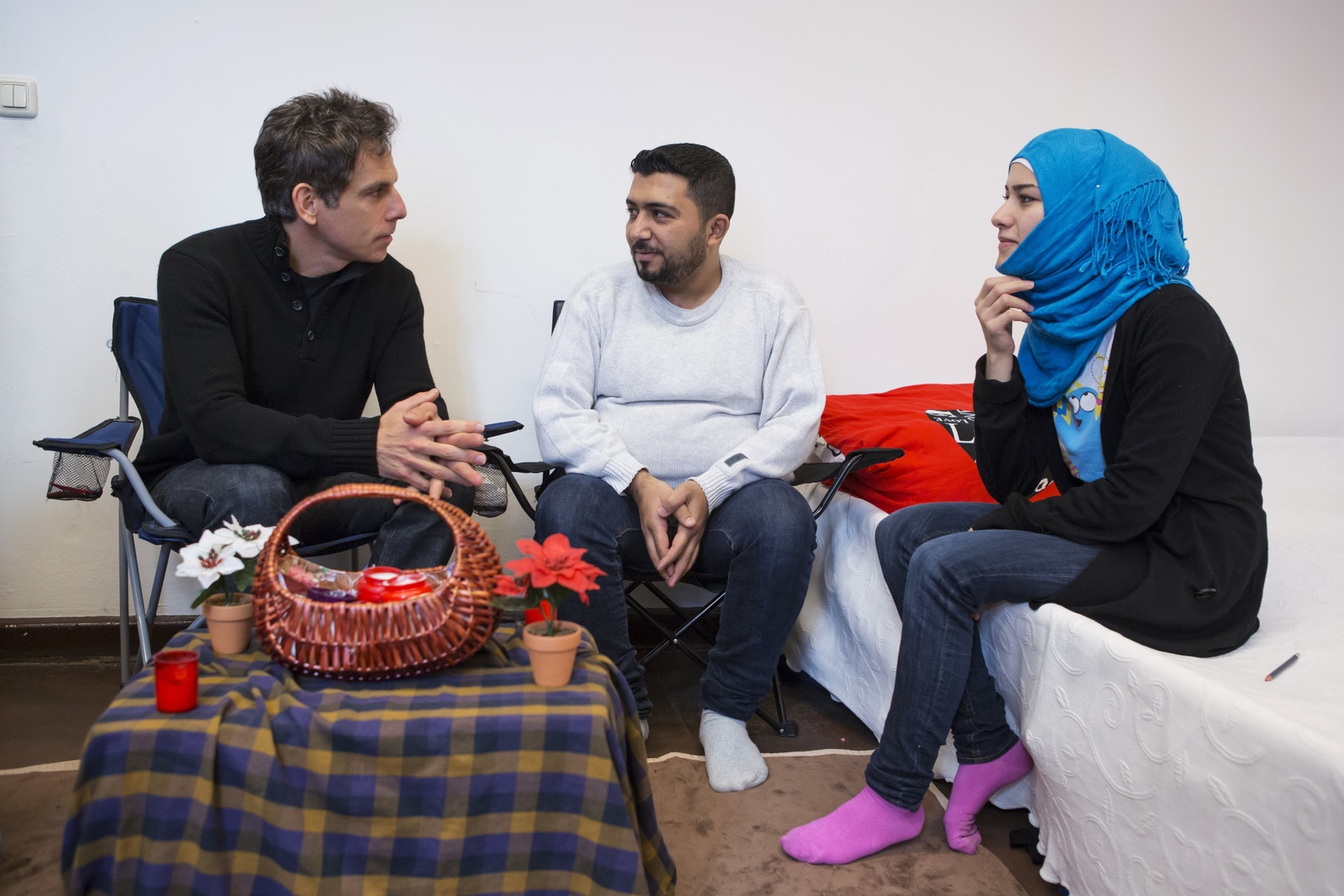 Germany. Actor Ben Stiller meets Nahed and her family at an emergency shelter in Berlin