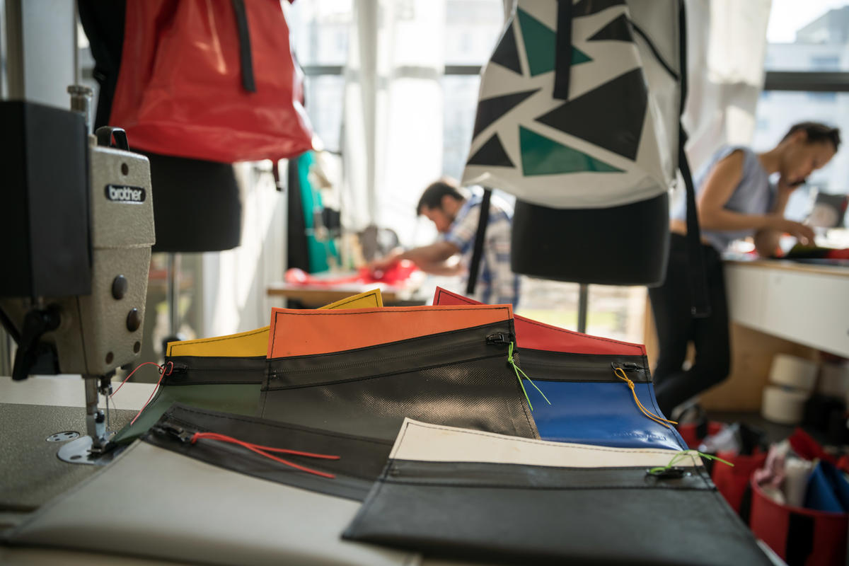 Germany. A non-profit initiative is employing newcomers to upcycle broken refugee boats into thought-provoking products.