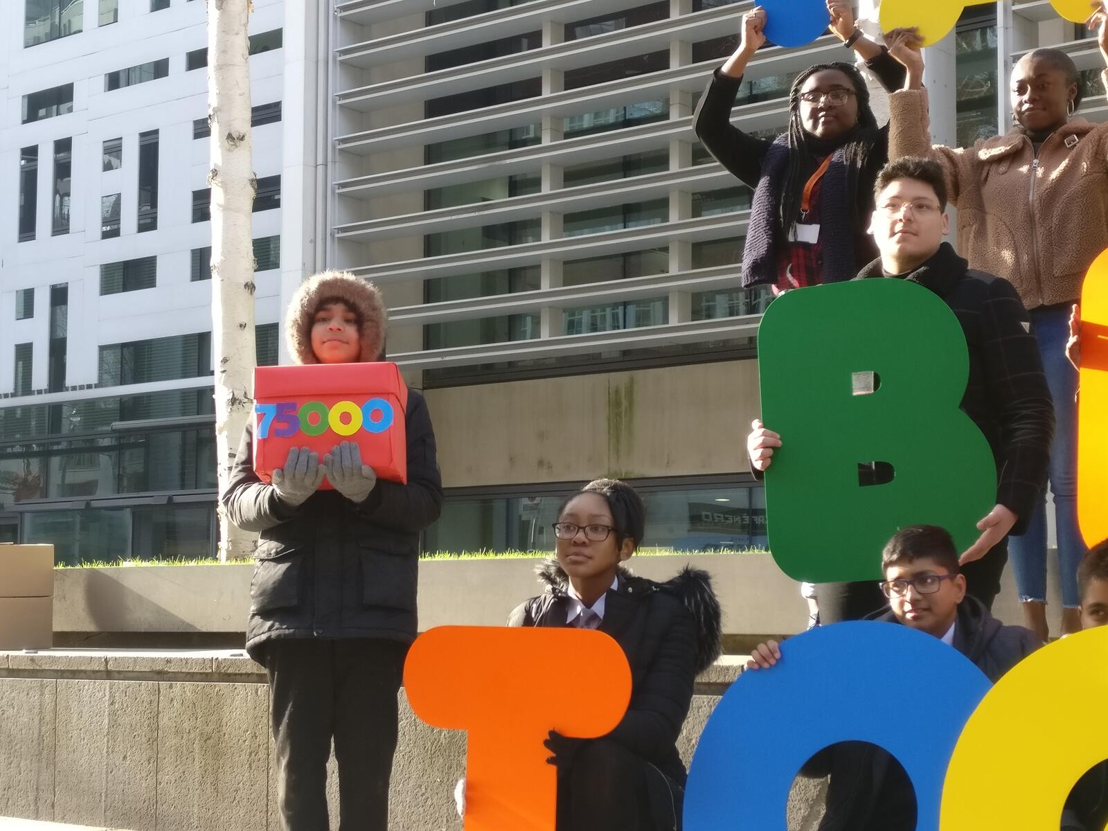 Pupils from a school in London's Bethnal Green hand in the Families Together petition