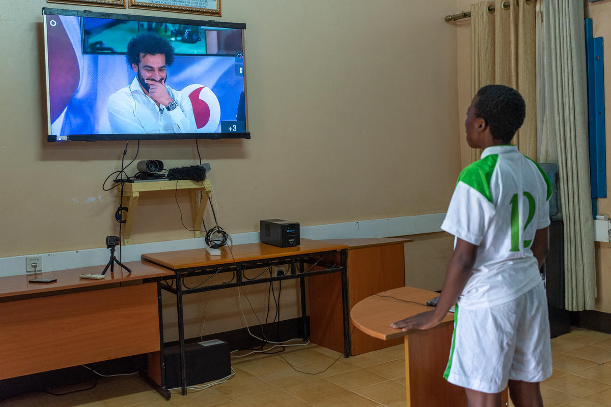 Kenya. Football player for the Kakuma Stars, Bitisho, talks to Mo Salah live from London