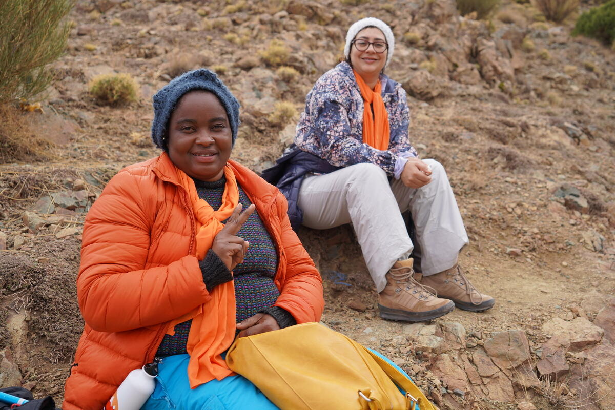 Morocco. Refugee women climbing the Toubkal.