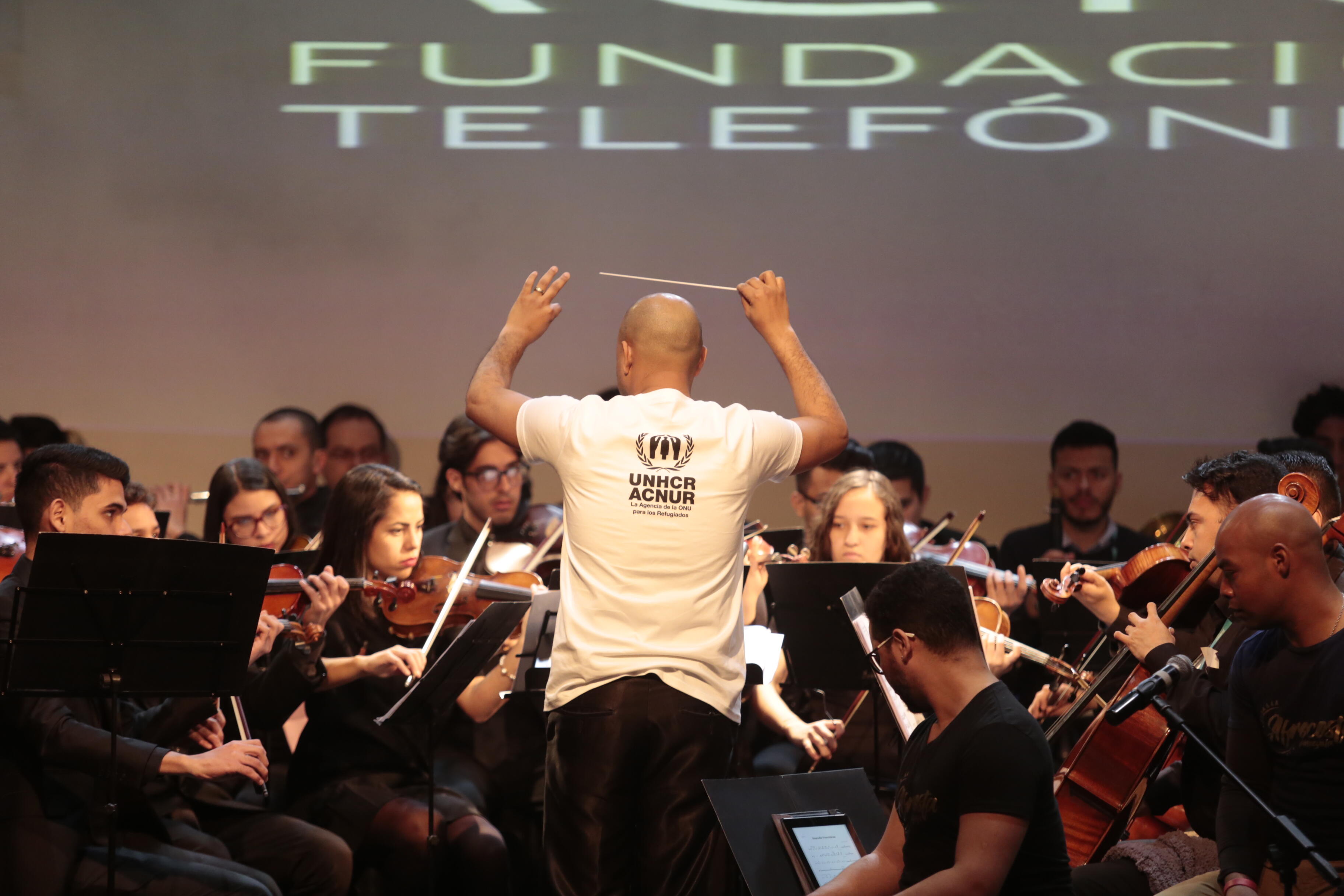 The Music for Integration Foundation Orchestra, led by Venezuelan conductor Simón Arias, performs in Santiago, Chile, in 2019.