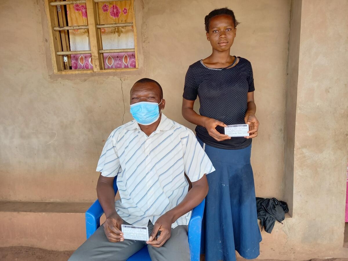 Angola. Refugees shows proof of covid-19 certificate at Lovua settlement