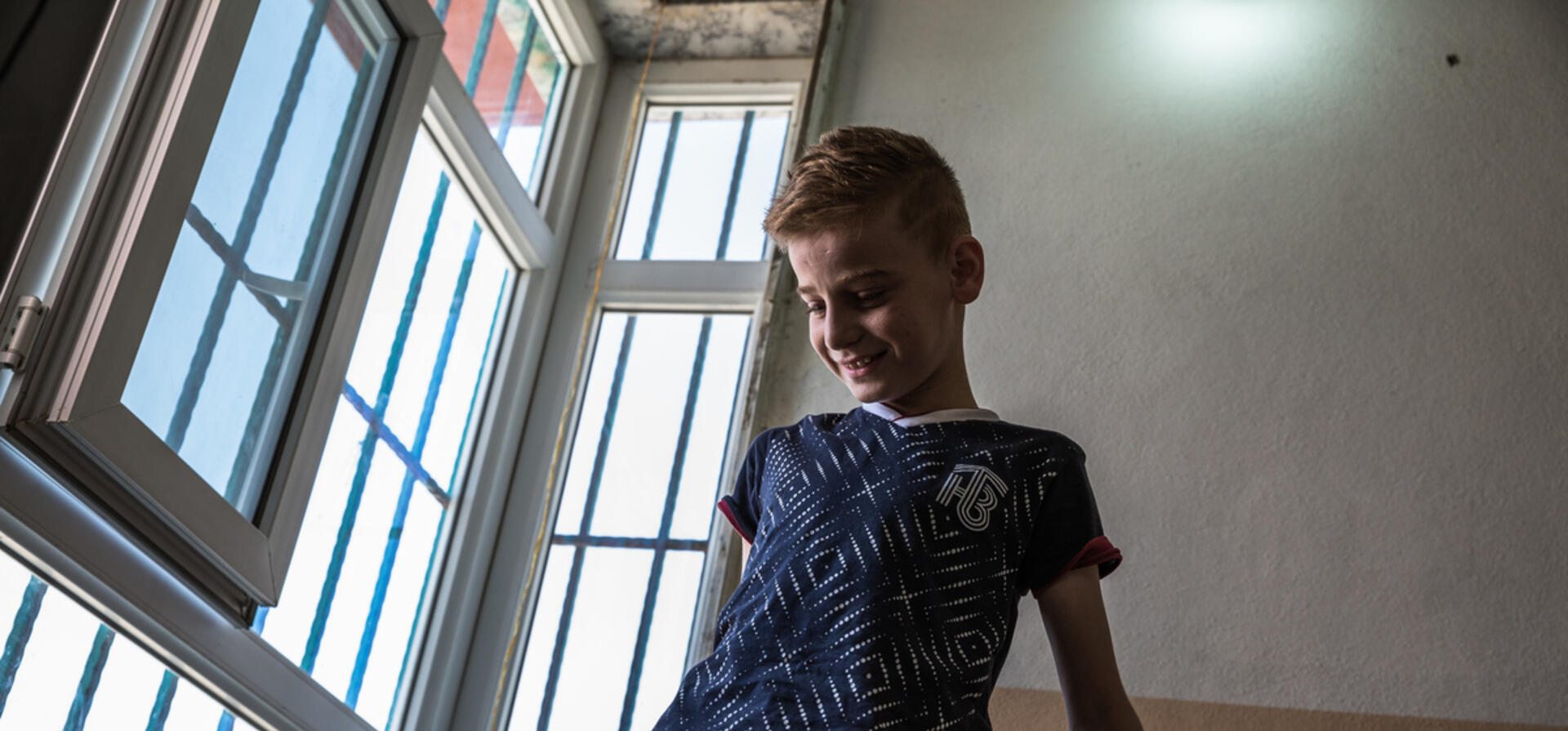 Iraq. Yazidi child gets ready to reunite with his mother in Canada