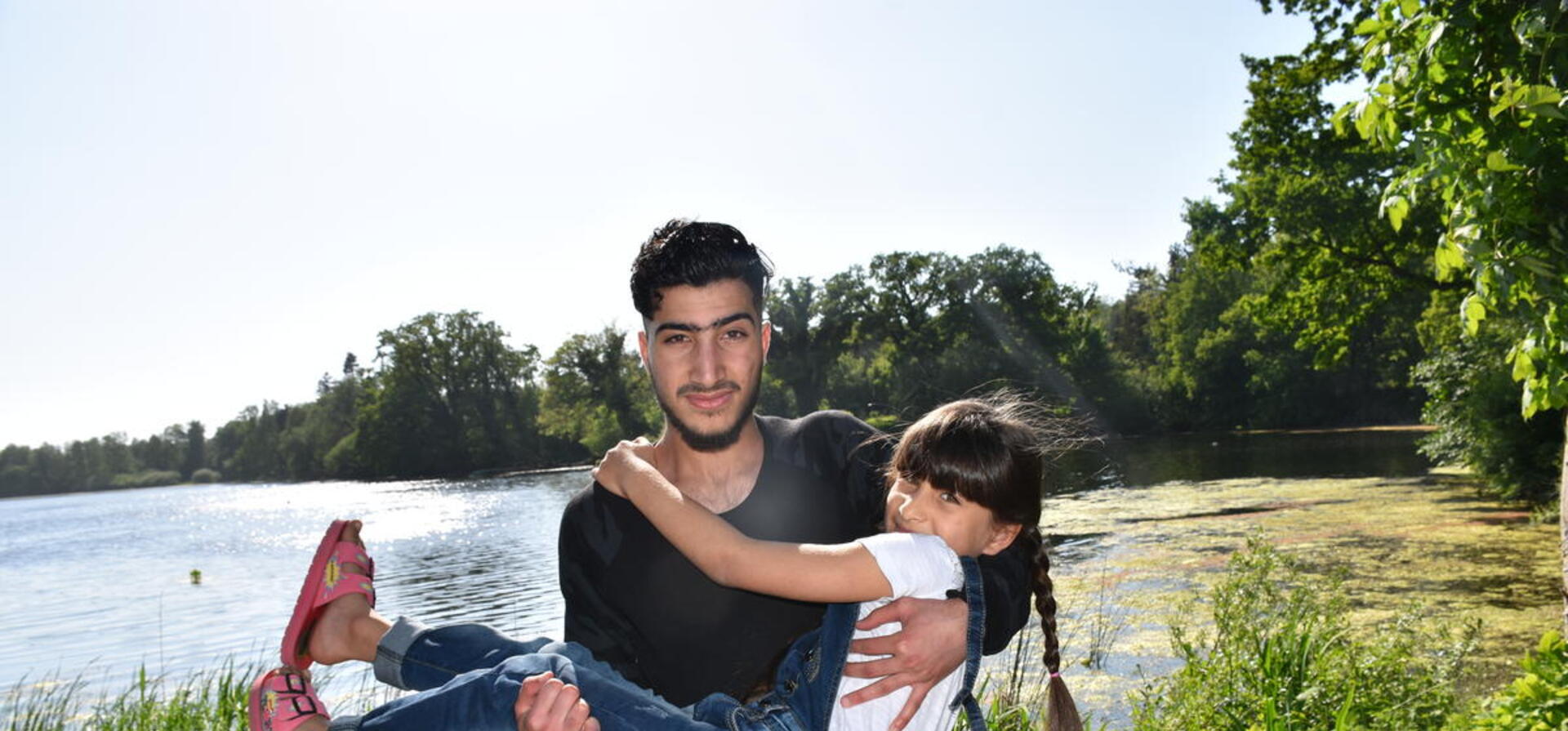 Refugee from Syria hugs his sister in Lensahn, northern Germany