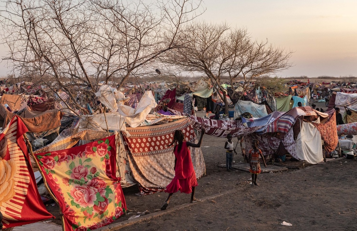 Children play near a makeshift camp.