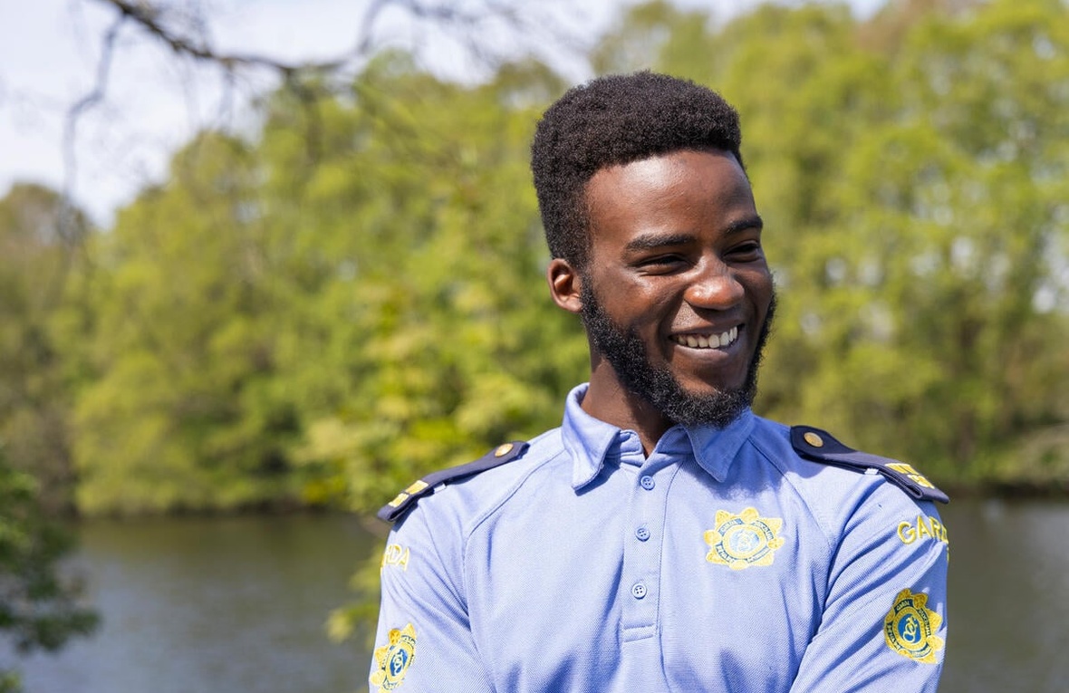 Emmanuel Tacima Samuel wearing a community Garda shirt.
