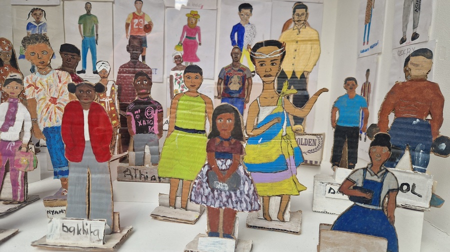 Portraits painted on paper and cut out card board figures 