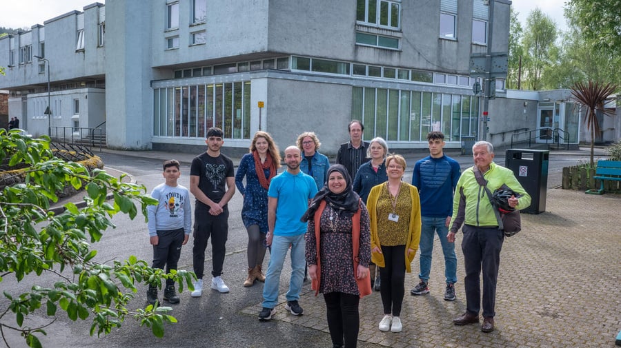 A group of people pictured outside the library in Rothesay