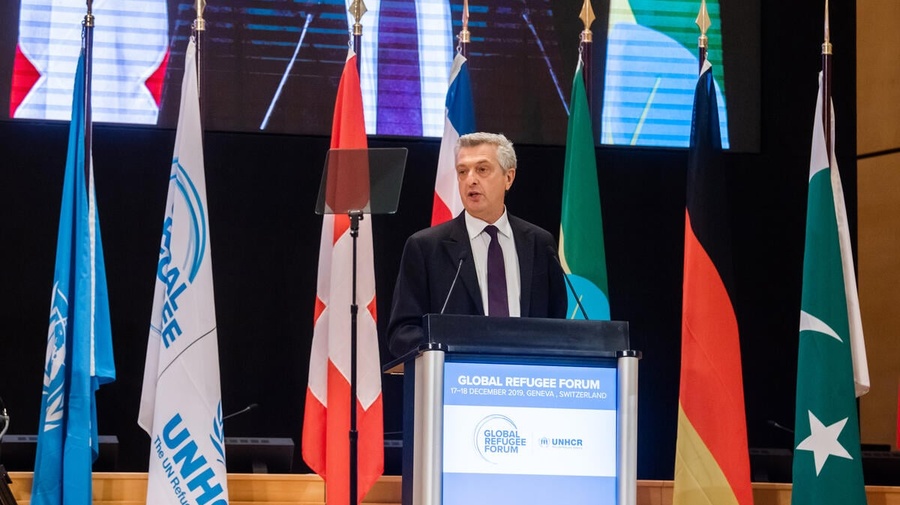 Filippo Grandi, the High Commissioner for Refugees, speaks from a podium during the 2019 Global Refugee Forum.  