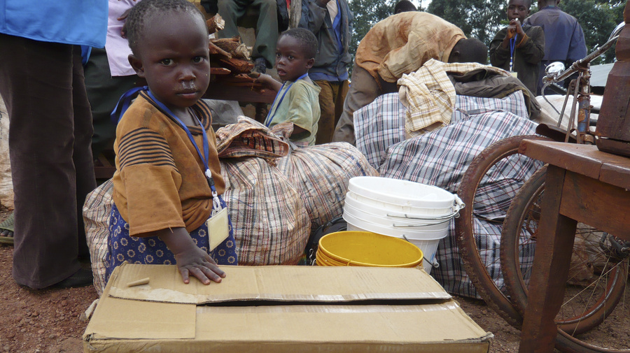 A baby, born a refugee in Tanzania, on her first morning in her homeland of Burundi after returning in a UNHCR-organized convoy.