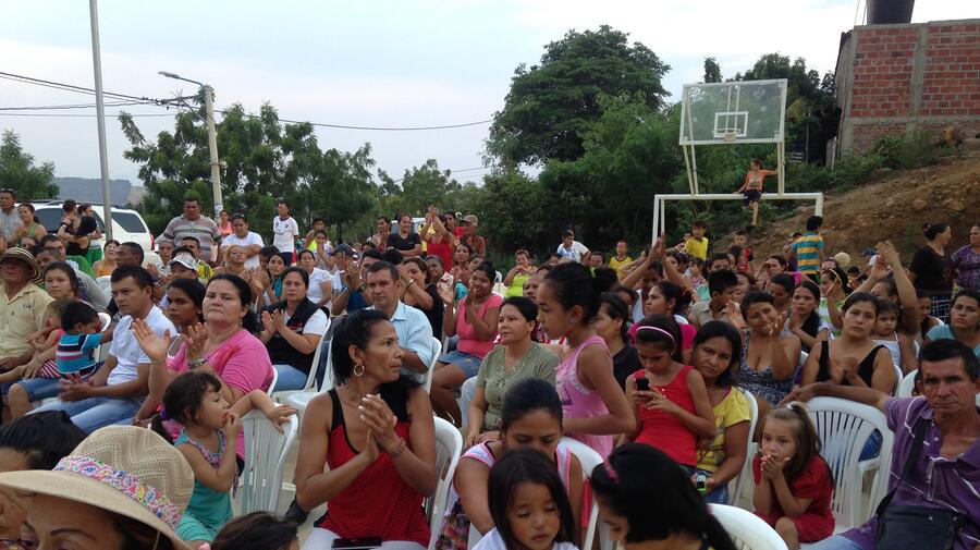 Residents of the informal Las Delicias neighbourhood of Cúcuta , Colombia attend a ceremony at which their settlement is incorporated into the city.