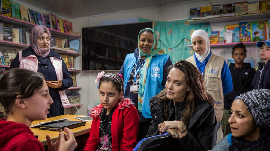 UNHCR Special Envoy Angelina Jolie talks to Syrian children at Za'atari camp in Jordan.