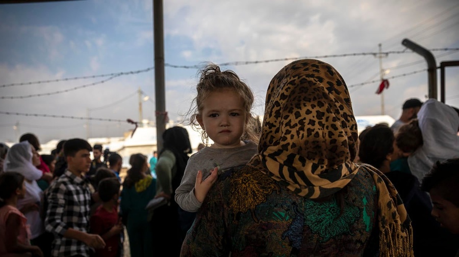 Iraq. Syrian refugees fleeing military campaign receive aid at UNHCR camp