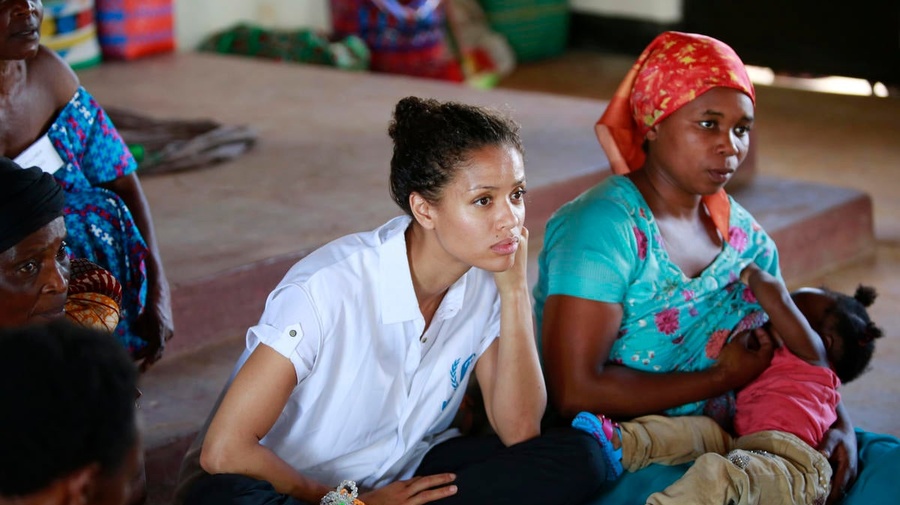 Uganda. UNHCR Supporter Gugu Mbatha-Raw at the Women's Centre in Nakivale Refugee Settlement, with Sifa Semeki, a refugee.