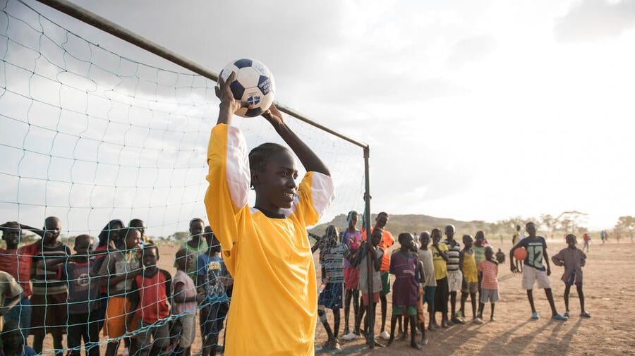 Kenya. Margaret Monday Dominic, 15 plays football with her friends and classmates