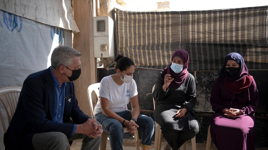 The High Commissioner for Refugees, Filippo Grandi, attending to Hind al-Hamad a 41 year old Syrian refugee, (the overseer of 3 camps) and Majida Shehada Ibrahim,36 years old Syrian refugee,(to the right of the image) while they explain what they need and what they are short of in the camp.