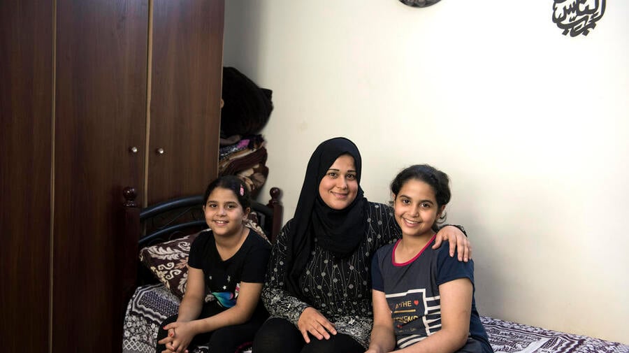 Jordan. Hanaa (27) and her daughters Joudy (12) and Lojain (10) at home