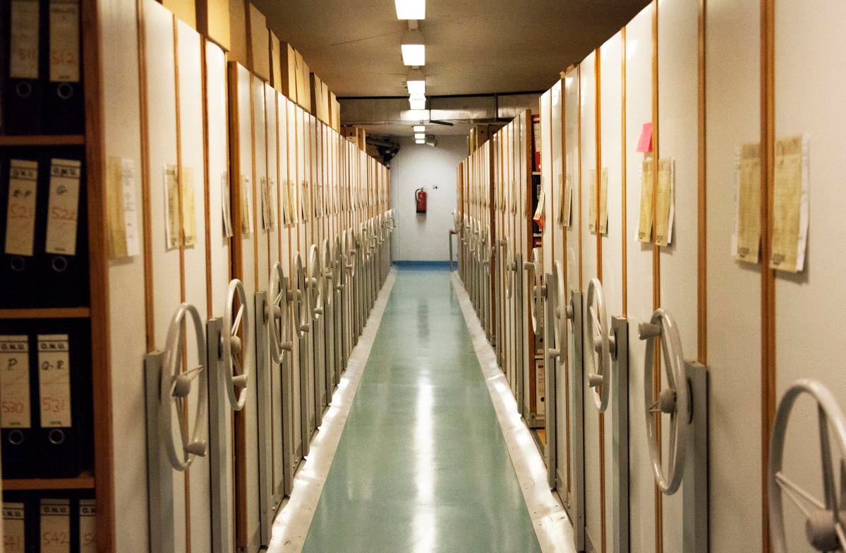 A view along a corridor of rolling stack archive shelves