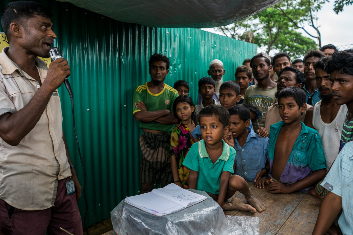 Bangladesh. Lost Rohingua children helped at information booth
