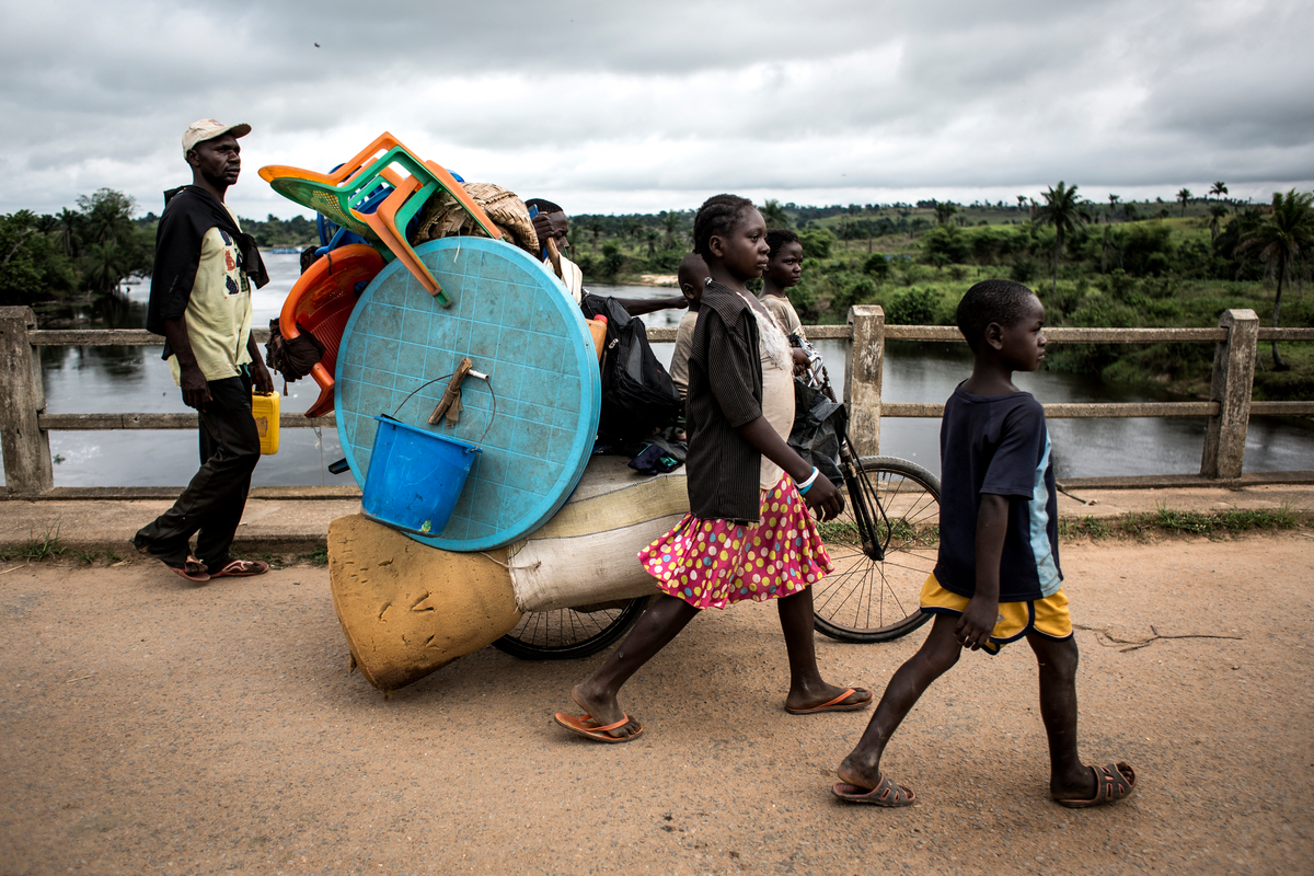 Democratic Republic of Congo. A family of Internally displaced persons are seen on the road whilst fleeing to kananga.