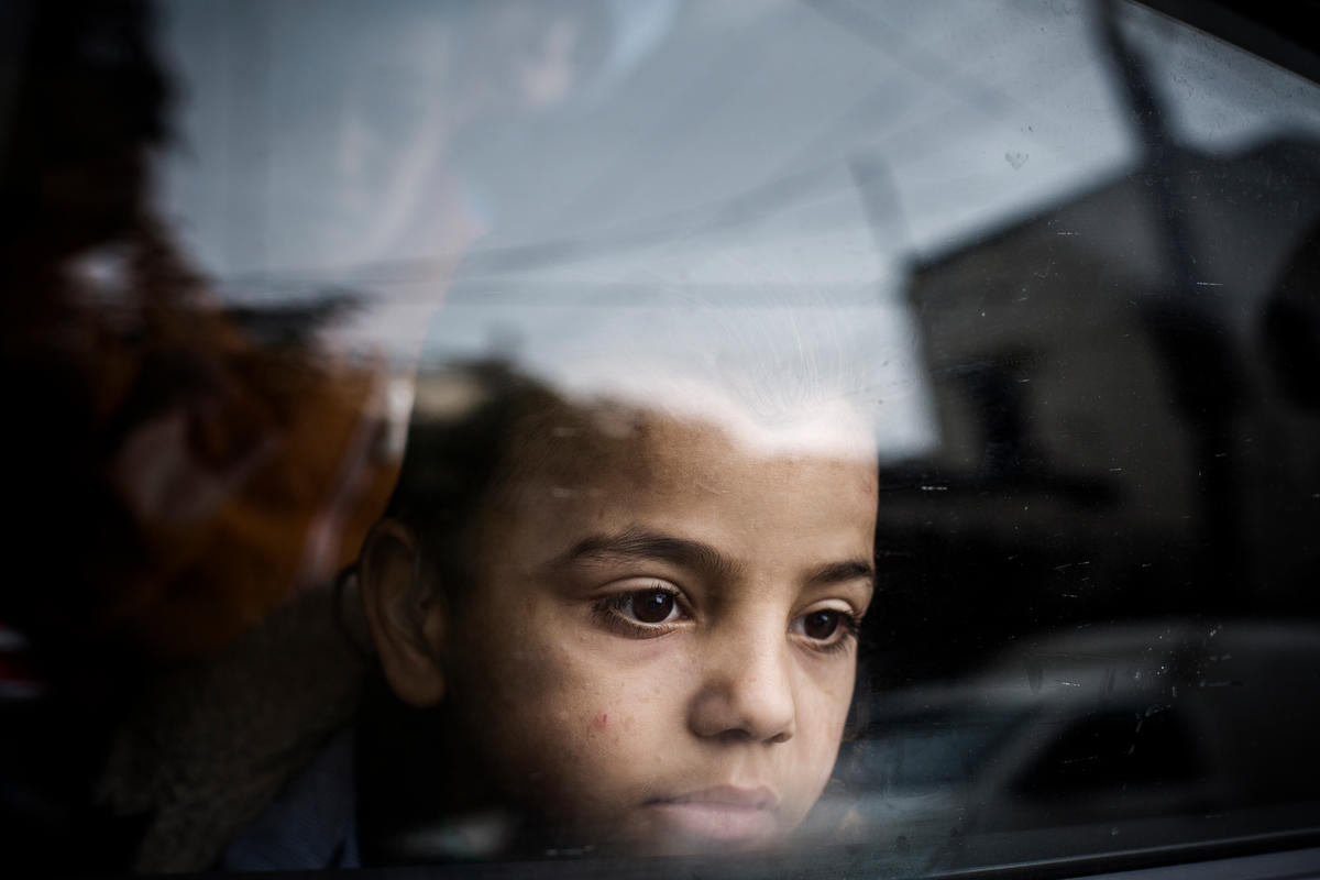 Mohammad gazes out of a window on the outskirts of Beirut in Lebanon.