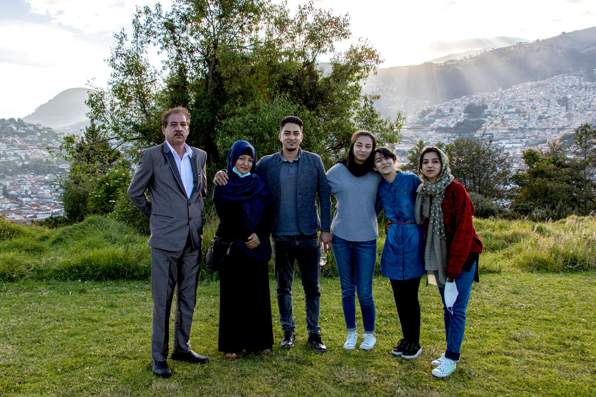 Zohra and her brother Hasibullah revel in the Quito sunset, surrounded by additional members of their immediate family.