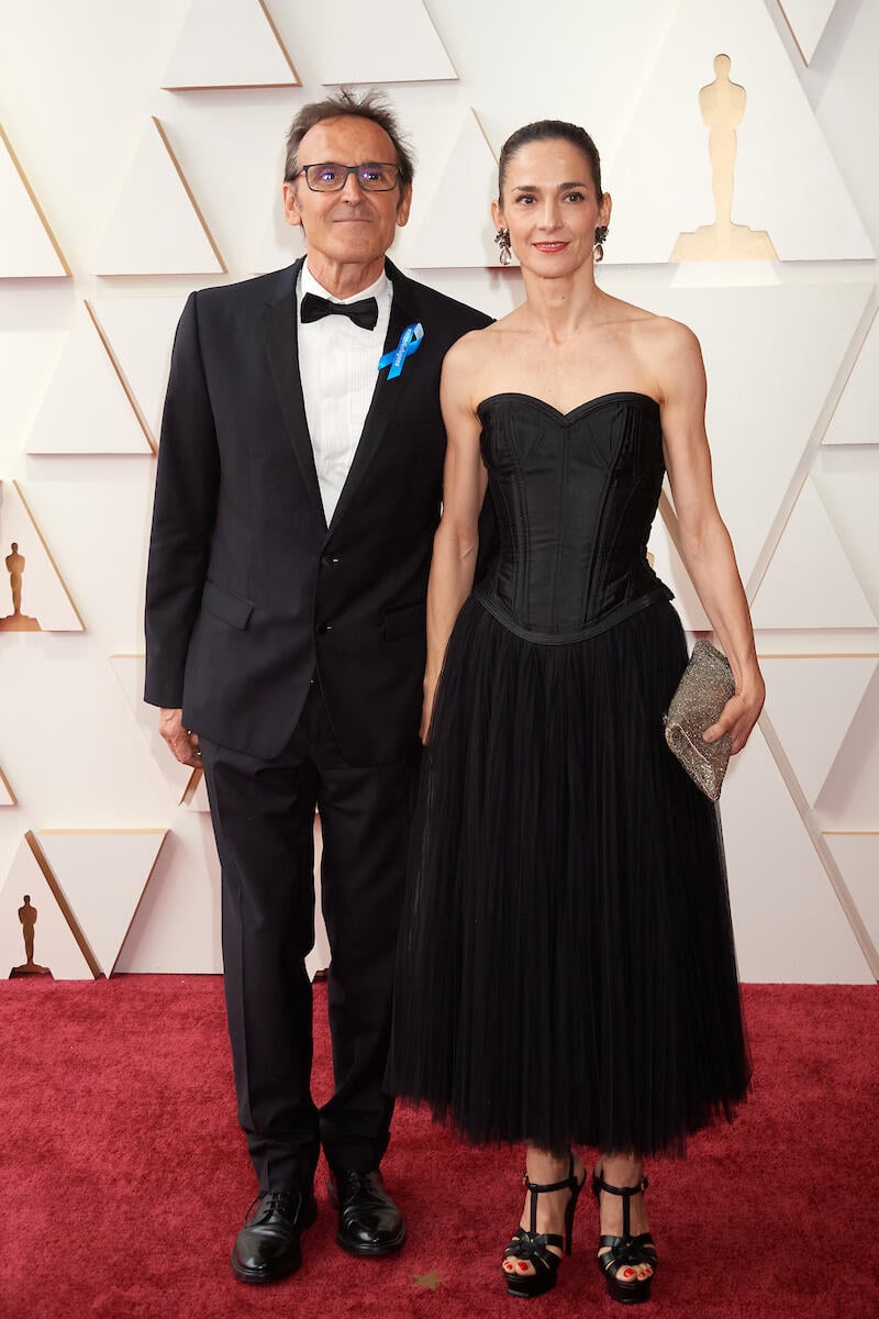 United States. 94th Oscars nominee Alberto Iglesias arrives with guest at the Oscar Nominee Luncheon wearing a blue ribbon in solidarity with refugees