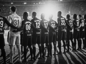 AI-assisted rearview image of a football team lined up on the pitch inside a brightly lit stadium 