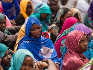 Sudanese refugees gather outside