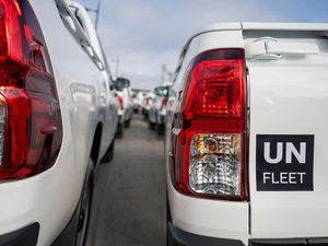 Close up of two UN FLEET vehicles, pictured from behind