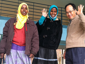 Nasra (left in yellow scarf) with fellow refugee Farah and a teacher at a language school in Iksan, South Korea.