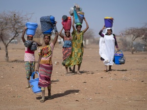 Malian refugees collect aid items at Goudoubo camp, Burkina Faso, February 2020.