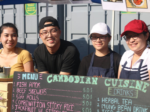 USA – Sokhita Sok, friend and sisters at her stand at Queens Night Market.