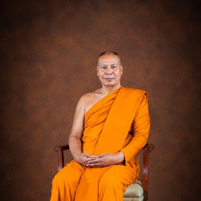 Portrait photo of Anil Sakya seated in a chair