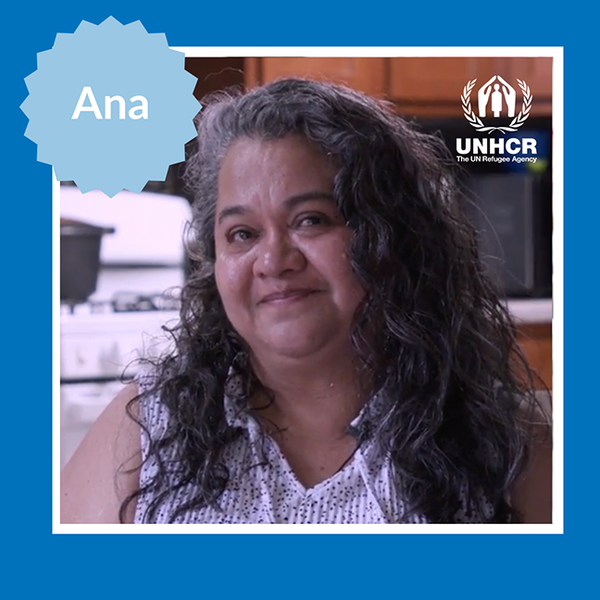 woman with graying hair in front of her kitchen