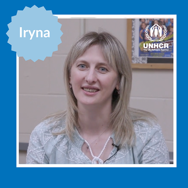 woman with blond hair in front of wall in school