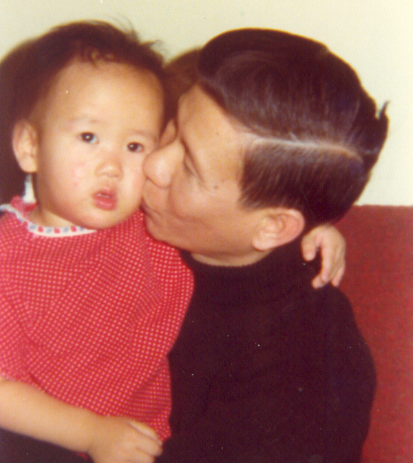 Bao Phi's dad holding Bao as an infant.