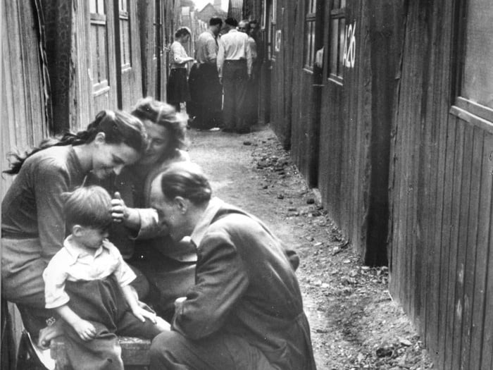 Black and white photo of refugee family in a camp in Europe