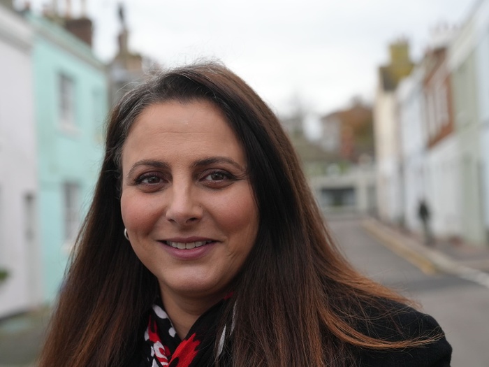 A woman standing in the middle of a street
