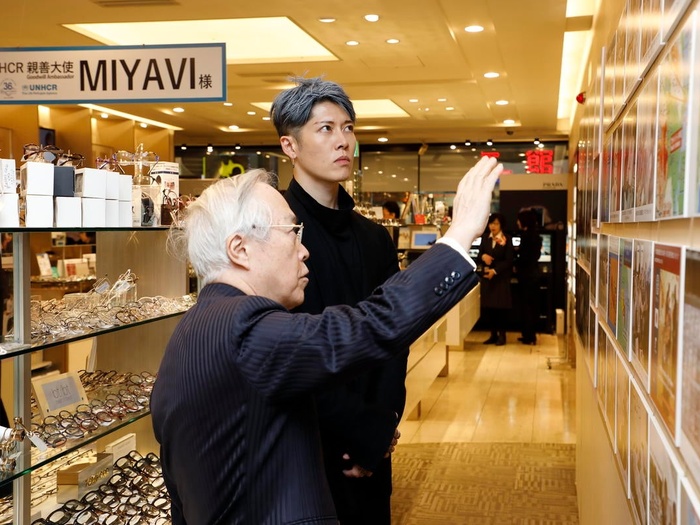 MIYAVI pictured with Dr. Akio Kanai in Dr Kanai's store and spectacle laboratory.