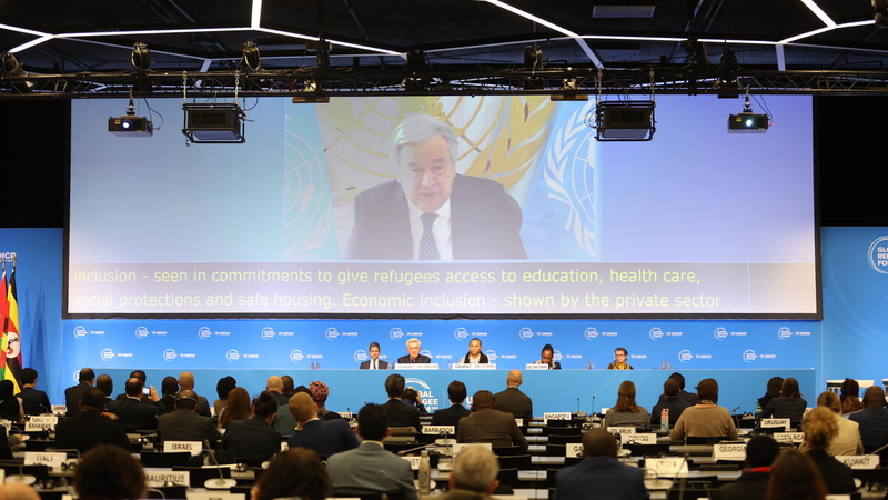 Antonio Guterres, United Nations Secretary-General, is seen onscreen at the final plenary and Closing Ceremony of the Global Refugee Forum 2023.