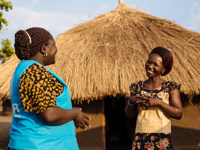 South Sudanese refugee speaks with a UNHCR staff member in Uganda. 