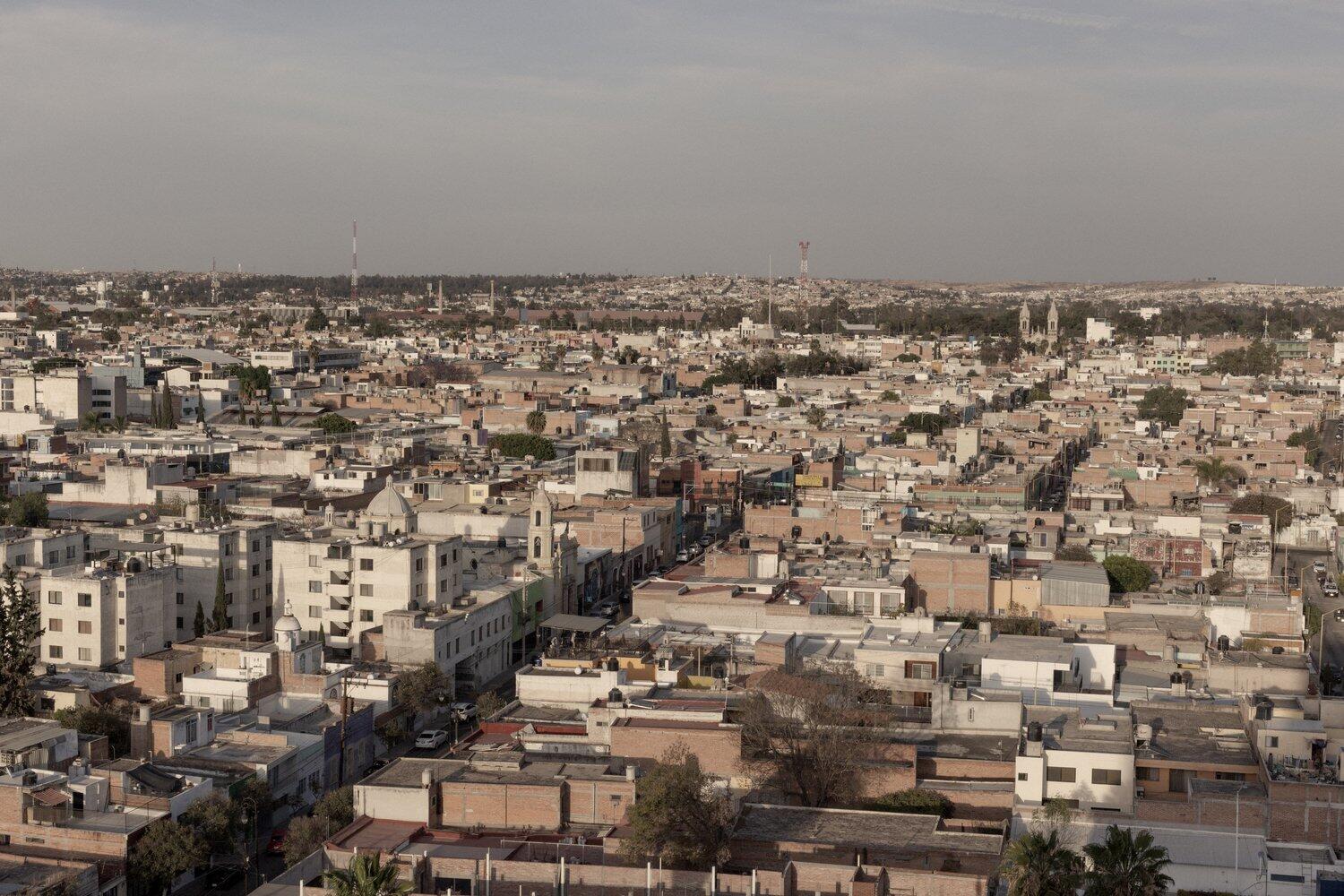 A rooftop view of a city.