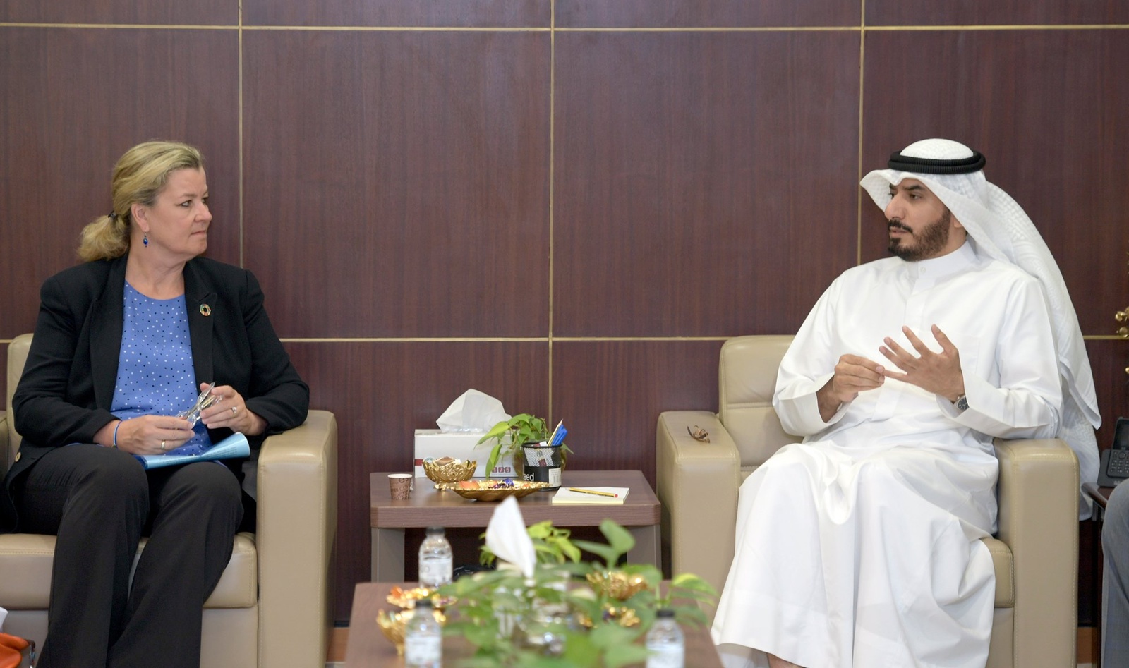 Mr. Majed AlAzmi in conversation with the Deputy High Commissioner, Ms. Kelly T. Clements