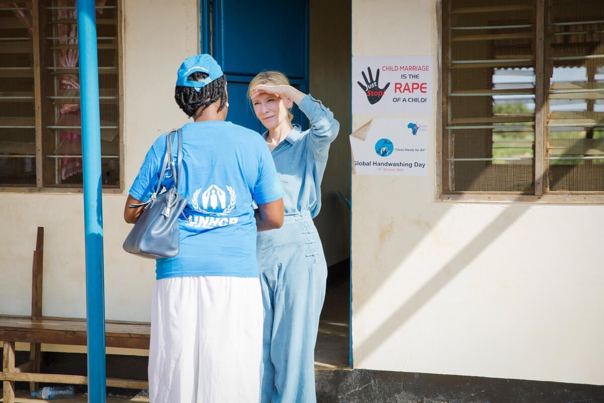 Cate in conversation with a UNHCR worker outside a hospital