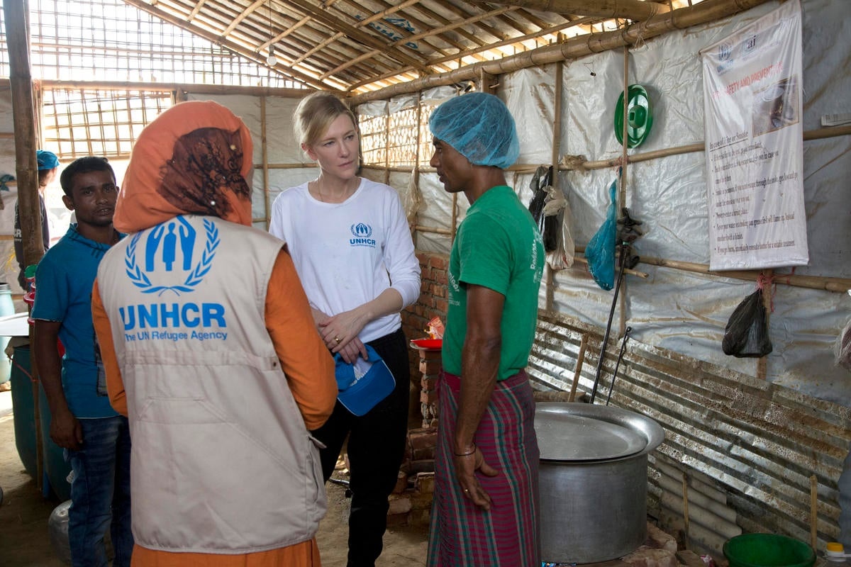 Cate talking with staff in the community kitchen