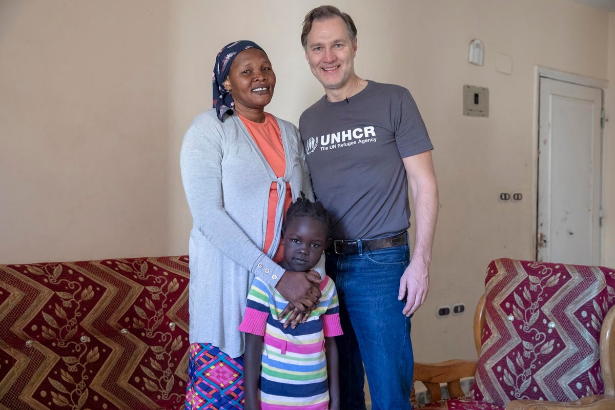 David Morrissey stands next to Marina and her daughter.