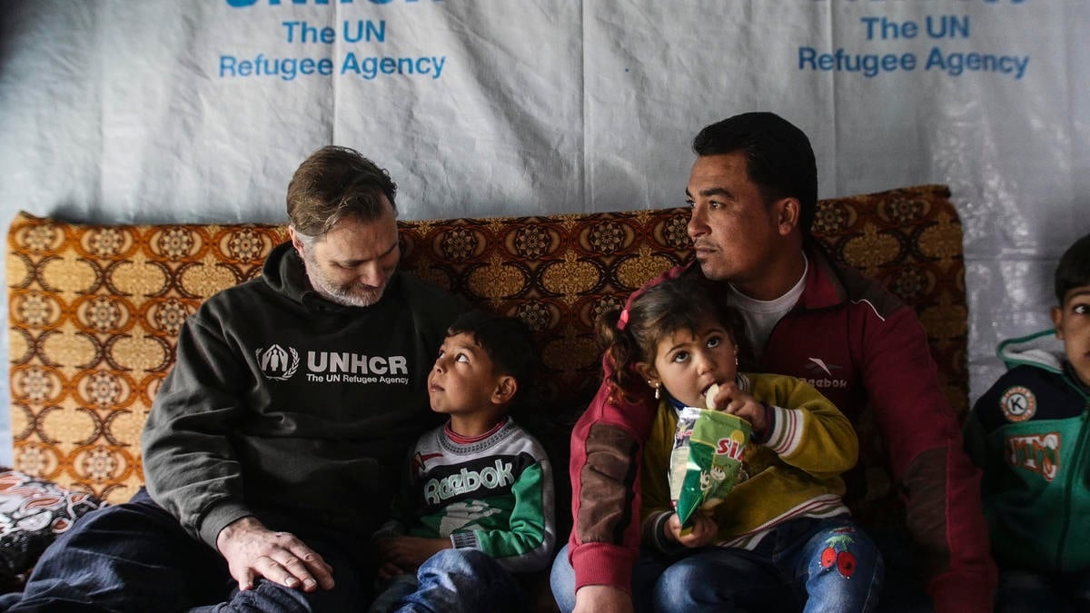 David Morrissey talks to a young child, sitting next to a man and his daughter.
