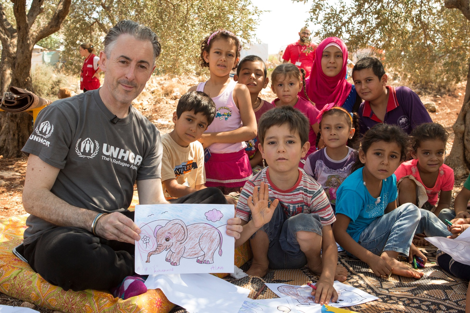Lebanon. UNHCR High Profile Supporter Alan Cumming visits mobile library at Rass Maska informal settlement.